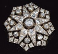 Late Victorian brooch in the form of a star set with old cut diamonds, the largest approximately 0.