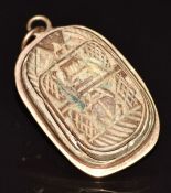 A yellow metal pendant set with an Egyptian Revival ceramic scarab beetle, 19.3g