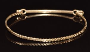 A 9ct gold bangle, 5.4g