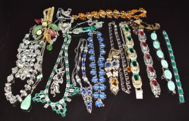 A collection of Art Deco necklaces including a platinon example, silver WBs example, etc and three