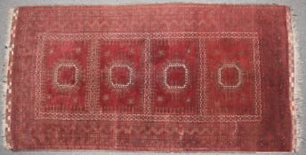 Turkoman rug with wine ground and chequered elim, 245 x 126cm