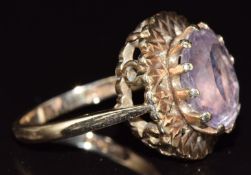 A 9ct gold ring set with an oval cut amethyst, 5.9g, size N