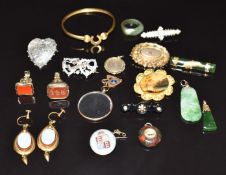 A collection of Victorian jewellery including horseshoe bangle, painted miniature set into a gilt
