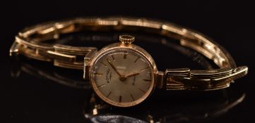 Rotary 9ct gold ladies wristwatch with gold hands and hour markers, silver dial and 21 jewel