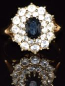 A 14k gold ring set with a sapphire and cubic zirconia, 4.5g, size O