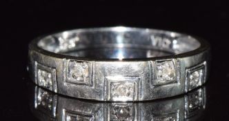 A 9ct white gold ring set with five diamonds, 2.2g, size T