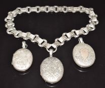 Three silver/ white metal Victorian lockets, two with engraved floral decoration and one heron and