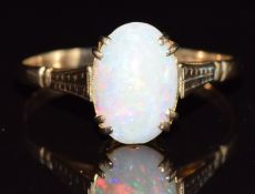 A 9ct white gold ring set with an opal cabochon, 1.8g, size R