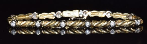An 18ct gold bi-coloured bracelet set with diamonds, 16.6g, 18cm long