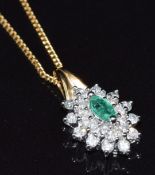 A 9ct gold pendant set with a marquise cut emerald and diamonds, on 9ct gold chain, 2.5g, 47cm long