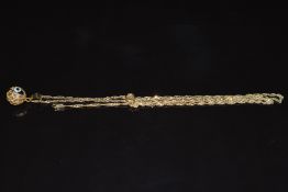 A 14k gold chain/ necklace with 14k gold and glass eye pendant, 3.4g, 43cm long