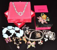 A collection of Butler & Wilson jewellery including four brooches, two bracelets, a pair of