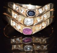 A 14k gold ring set with a ruby, white sapphire and sapphire, 4.1g, size O