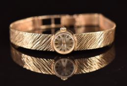Omega 9ct gold ladies wristwatch ref. 7115658 with two-tone hands and hour markers, silver dial