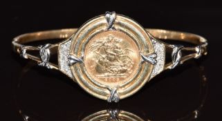 A 9ct gold bangle set with a 2003 gold half sovereign and diamonds, 21.5g, 6 x 5.2cm