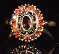 A 9ct gold ring set with garnets, 2.3g, size J