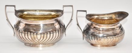 George V hallmarked silver sugar bowl and milk jug, with reeded lower bodies, Sheffield 1935,