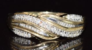 A 14k gold ring set with baguette and round cut diamonds, 3.2g, size P