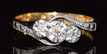 An 18ct gold ring set with diamonds in a platinum setting, 3.4g, size L