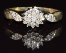 A 9ct gold ring set with diamonds in a cluster, in vintage box, 2.9g, size Q