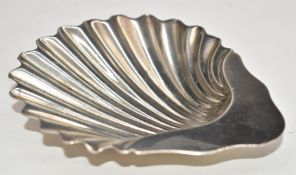 Goldsmiths & Silversmiths Company Victorian hallmarked silver shell shaped dish, the three feet