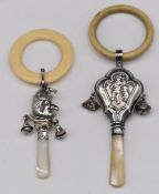Two hallmarked silver baby's rattles, one formed as Mr Punch, Chester 1959, maker's mark rubbed, the