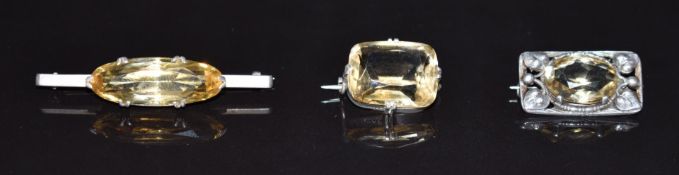 Arts & Crafts silver brooch set with a citrine, and two other Victorian brooches set with citrines