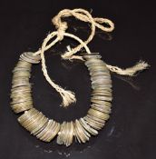 Chinese metal coins/tokens on a string