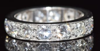 A platinum eternity ring set with fourteen round cut diamonds each approximately 0.25ct, total