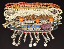 A collection of costume jewellery including agate beads, silver brooch, paste items, garnet