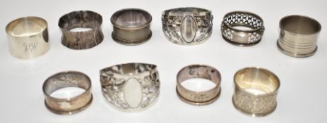 Six hallmarked silver napkin rings including a pair of Scottish thistle design Walker & Hall