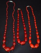 Three cherry amber necklaces, 137g