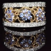 A 9ct gold ring set with tanzanites and diamonds, 3.7g, size N