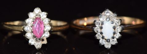 Two 9ct gold rings, one set with a ruby and diamonds in a marquise shaped setting and the other opal