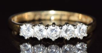 An 18ct gold ring set with five diamonds totalling approximately 0.5ct, 2.2g, size P
