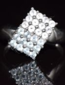 A 9ct white gold ring set with pink and blue tourmaline, 2.7g, size N