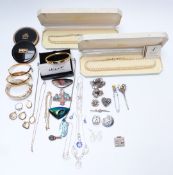 A collection of costume jewellery including faux pearls, Monet bangle, compacts, brooches