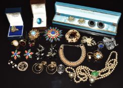 A collection of early Sarah Coventry jewellery including brooches, rings and earrings, some marked