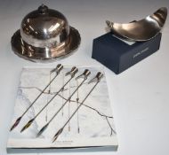 Georg Jensen set of four enamelled candle holders and a stainless steel dish, both boxed, and an