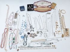 A collection of jewellery including silver charm bracelet, pearl necklace, silver pendants, Monet