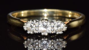 An 18ct gold ring set with three diamonds, 2.9g, size O/P