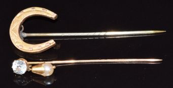 An 18ct gold French stick pin set with paste and a pearl and a Victorian stick pin in the form of