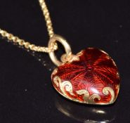 An 18ct gold heart pendant set with red guilloché enamel (2.4g), on 9ct gold chain, 2.5g, 51cm long