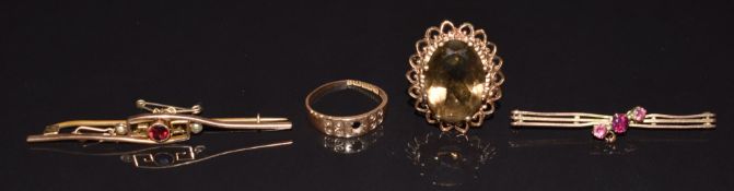Two 9ct gold brooches set with garnets, a 9ct gold ring set with smoky quartz (11g) and a 15ct