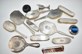 Hallmarked silver backed dressing table items comprising two hand mirrors, eight brushes and a comb,