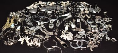A large collection of silver earrings