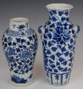 Two 19thC / 20thC Chinese blue and white vases, one with dragon decoration, both with character
