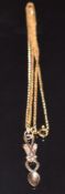 A 9ct gold pendant in the form of a Welsh love spoon, on 9ct gold chain, 2.8g, 37cm long
