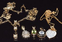 Five 9ct gold pendants set with peridot, crystal, paste and diamonds and two 9ct gold chains, 5.
