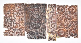 Four brisé cut tortoiseshell panels depicting birds, flowers, figures etc, largest 12 x 7cm